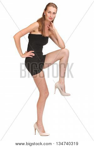 Elegant young woman in short little dress looking at camera. Isolated on white background.