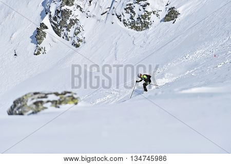 FAGARAS ROMANIA - MARCH 5: Ski mountaineer competes during the Ski Mountaineering National Competition in Fagaras Mountains Carpathian Range on March 5 2016 in Romania.