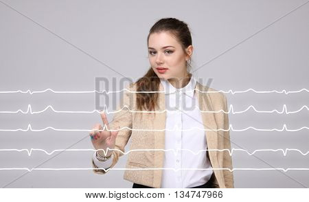 Doctor woman working with cardiogram lines