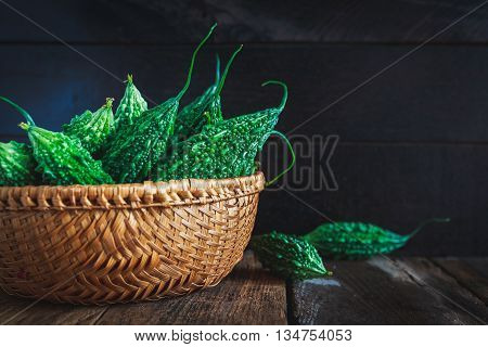 Green Bitter Melons on the old wood