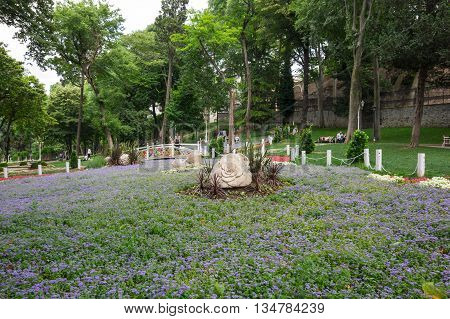 ISTANBUL TURKEY - JUNE 19 2015: People relaxing in Gulhane park in the historical center of Istanbul Turkey