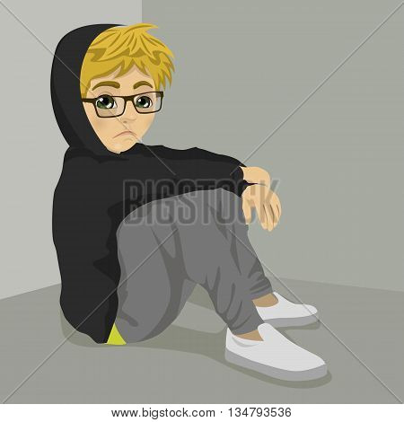 teenager nerd boy desperate sitting on the floor over grey background with dark clothes