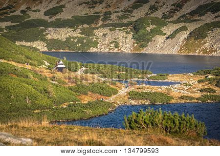 Beaitiful Mountain lake in the summer Valley of five lakes Poland Zakopane