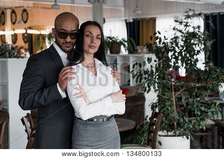 Portrait of an Arab businessman with a girl in the restaurant