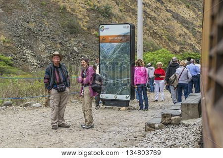 ALAUSI, ECUADOR, OCTOBER - 2015 - Group of tourists waiting to arrive at train at famous Devil Nose tour located in Aluasi town Ecuador