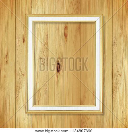 Antique gold frame on wooden wall ;. Empty picture frame on white wooden wall.