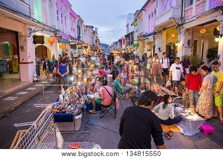PHUKET THAILAND MAY 29 2016: Tourists shop at night market of Phuket on May 29 2016.among old building Chino Portuguese style street of Phuket town is the famous Phuket and is a major tourist hub.