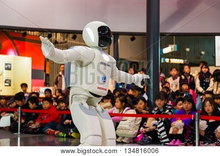 TOKYO JAPAN - NOVEMBER 27 2015: Asimo the humanoid robot created by Honda is presented at Miraikan The National Museum of Emerging Science and Innovation in Odaiba area