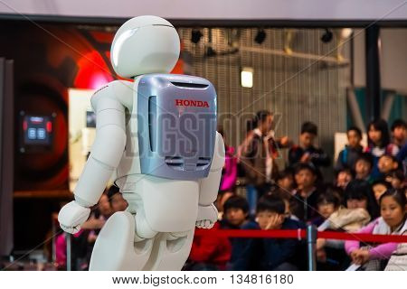 TOKYO JAPAN - NOVEMBER 27 2015: Asimo the humanoid robot created by Honda is presented at Miraikan The National Museum of Emerging Science and Innovation in Odaiba area