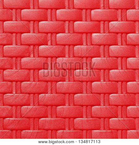 Plastic weave pattern texture and background; red color