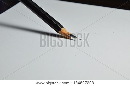 black pencil lead crack on white paper