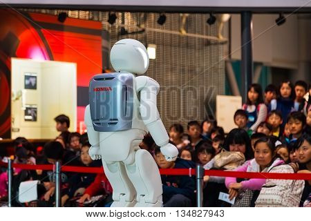 TOKYO JAPAN - NOVEMBER 27 2015: Asimo the humanoid robot created by Honda is presented at Miraikan The National Museum of Emerging Science and Innovation in Odaiba area