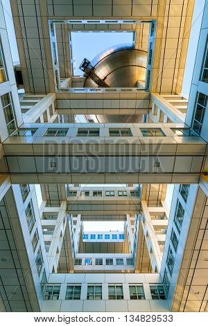 TOKYO JAPAN - NOVEMBER 27 2015: Fuji T.V. headquarters one of the most striking buildings in Japan. its' futuristic metallic clad building featuring a massive silver ball 32 metres in diameter