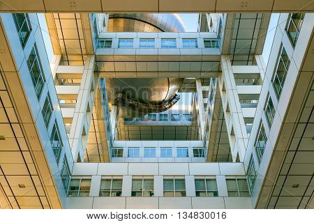 TOKYO JAPAN - NOVEMBER 27 2015: Fuji T.V. headquarters one of the most striking buildings in Japan. its' futuristic metallic clad building featuring a massive silver ball 32 metres in diameter