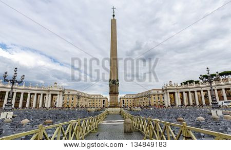 Vatican City Vatican - September 28 2015: Tourists at Saint Peter's Square in Vatican City Vatican. Saint Peter's Square is among most popular pilgrimage sites for Roman Catholics.