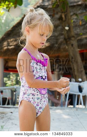 Playing girl on the beach in Thailand