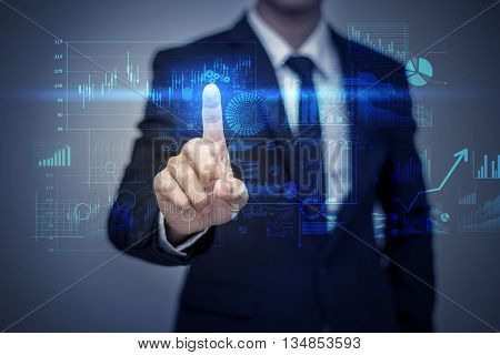 Businessman in suit working with digital virtual screen