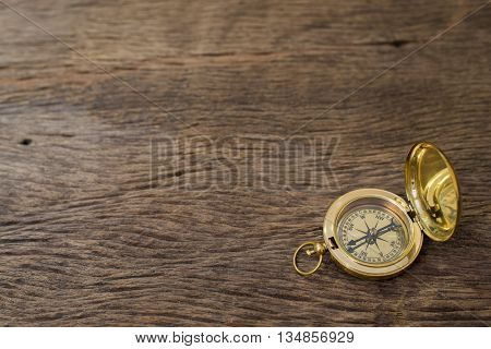beautiful Old Compass on wooden desk background