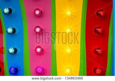 The colored lights on a fairgound ride