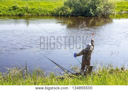 The river Kargat Novosibirsk oblast Siberia Russia - June 12 2016: fisherman lure fish in the river