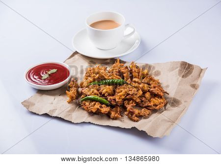Samosa snack with tomato ketchup and hot tea, Fresh samosas with ketchup and hot chai ready for breakfast