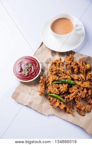 Samosa snack with tomato ketchup and hot tea, Fresh samosas with ketchup and hot chai ready for breakfast