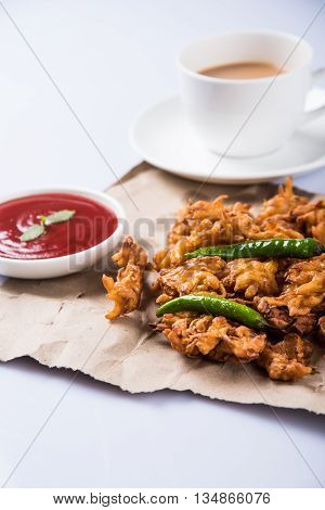 Samosa snack with tomato ketchup and hot tea, Fresh samosas with ketchup and hot chai ready for breakfast