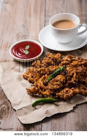 Samosa snack with tomato ketchup and hot tea, Fresh samosas with ketchup and hot chai ready for breakfast
