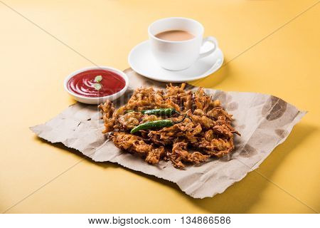 Samosa snack with tomato ketchup and hot tea, Fresh samosas with ketchup and hot chai ready for breakfast