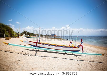 Traditional Balinese boat on a Sanur beach in Bali, Indonesia