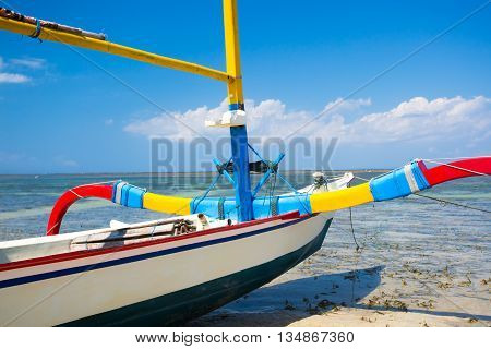 Traditional Balinese boat on a Sanur beach in Bali, Indonesia
