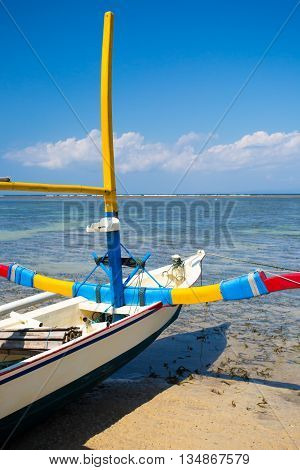 Traditional Balinese boat on a Sanur beach in Bali, Indonesia