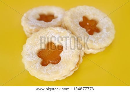 Shortbread cookies with jam and icing sugar