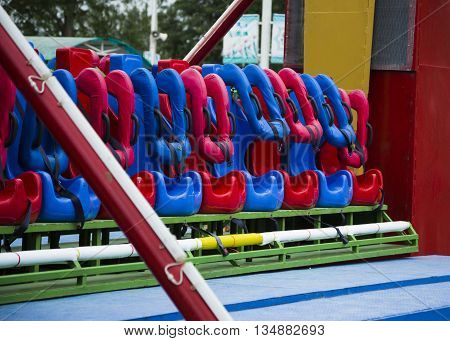 number red seat spinning swing as pilots