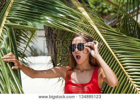 Woman on the beach in the red swimwear