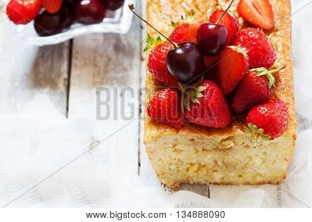 Fruitcake With Strawberry And Cherry Topping