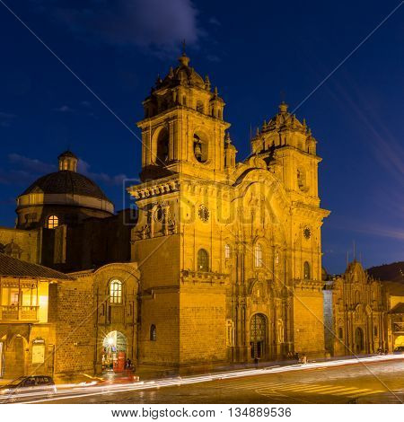 Central Cusco Peru church at night with light trails