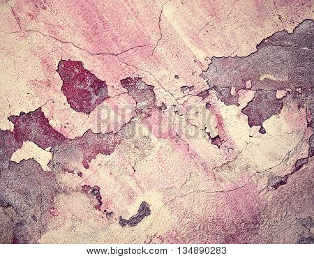abstract background old dingy burgundy cracked plaster wall