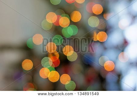 Abstract color bokeh light on defocused background.