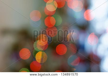 Abstract color bokeh light on defocused background.