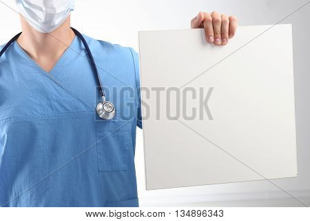 Male Doctor Showing Clipboard With Copy Space For Text