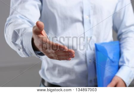 Businessman offering his hand for handshake. success