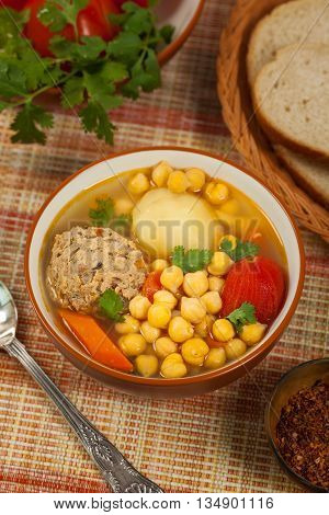 Homemade Chickpea Soup with Meatballs. Selective focus.