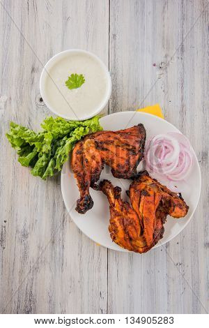 tandoori chicken leg, Tandoori Chicken , Indian spicy food, Delicious Tandoori chicken leg piece with Salad, India