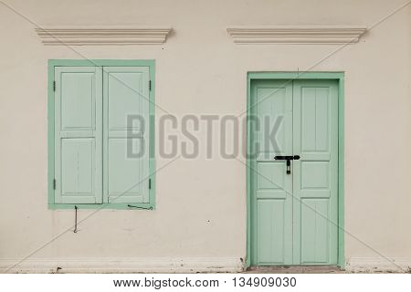 old window and door on color wall thai style vintage tone classic
