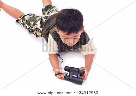 Cute little boy play binoculars on white background