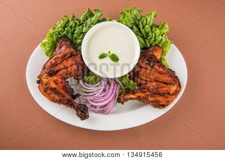 tandoori chicken leg, Tandoori Chicken , Indian spicy food, Delicious Tandoori chicken leg piece with Salad, India
