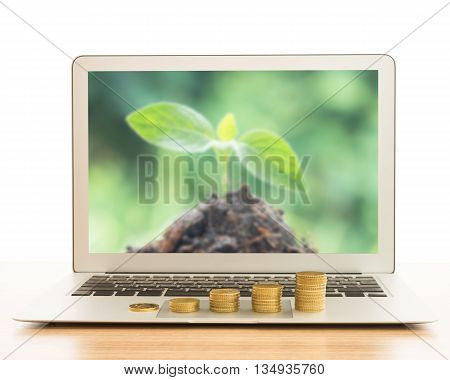 stack of gold coins on laptop computer. concept of business growth development investment growth investment concept growth concept.