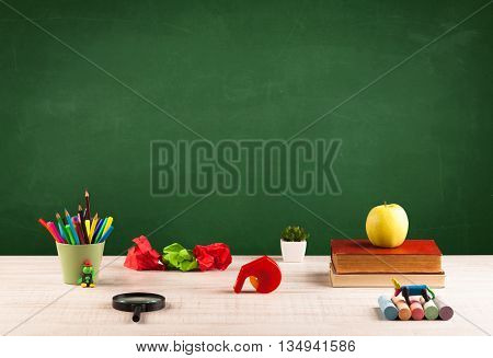 Back to school concepty with clear blackboard background, desk, items