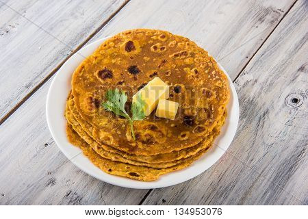 Hot delicious paratha with ghee and tomato sauce